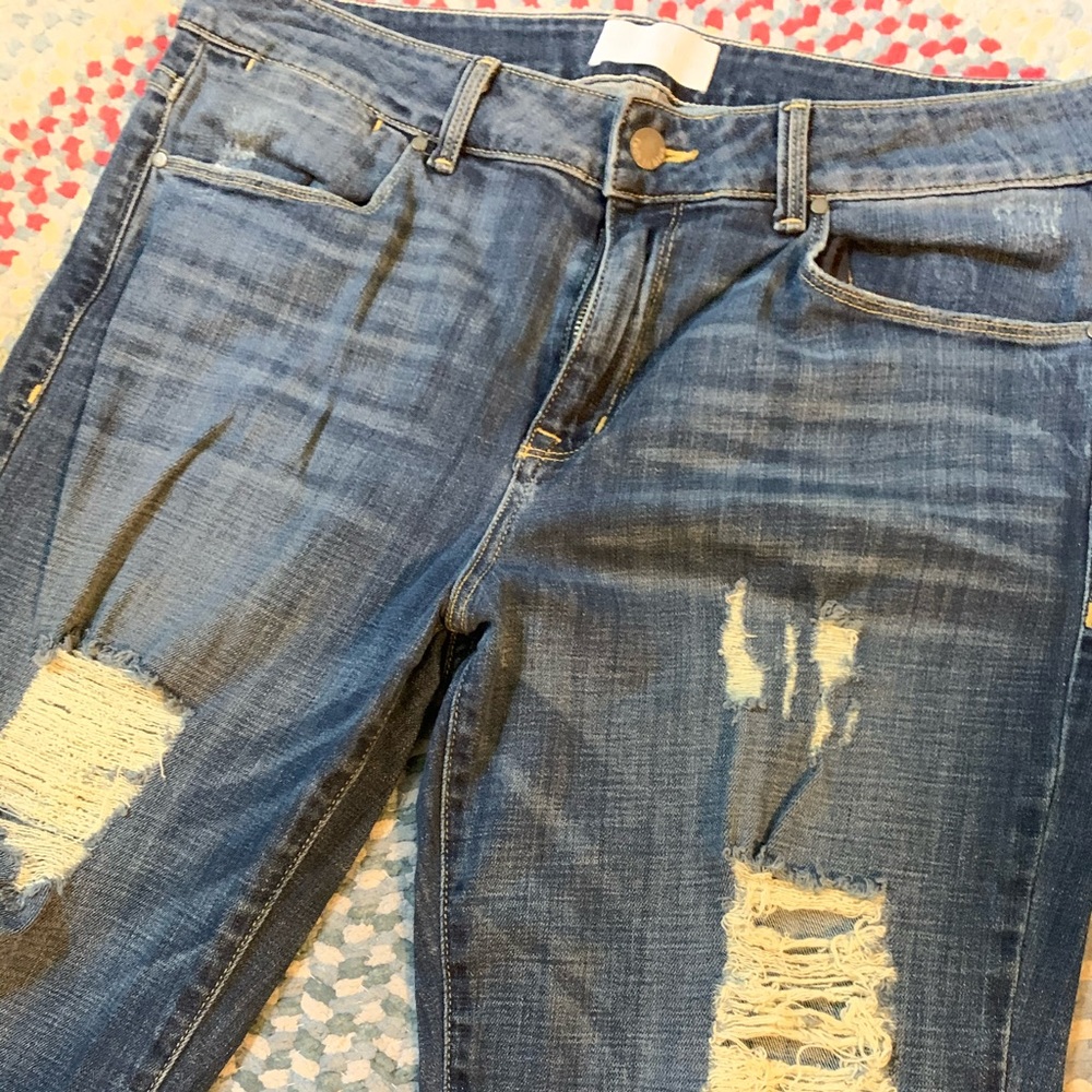 Distressed blue jeans